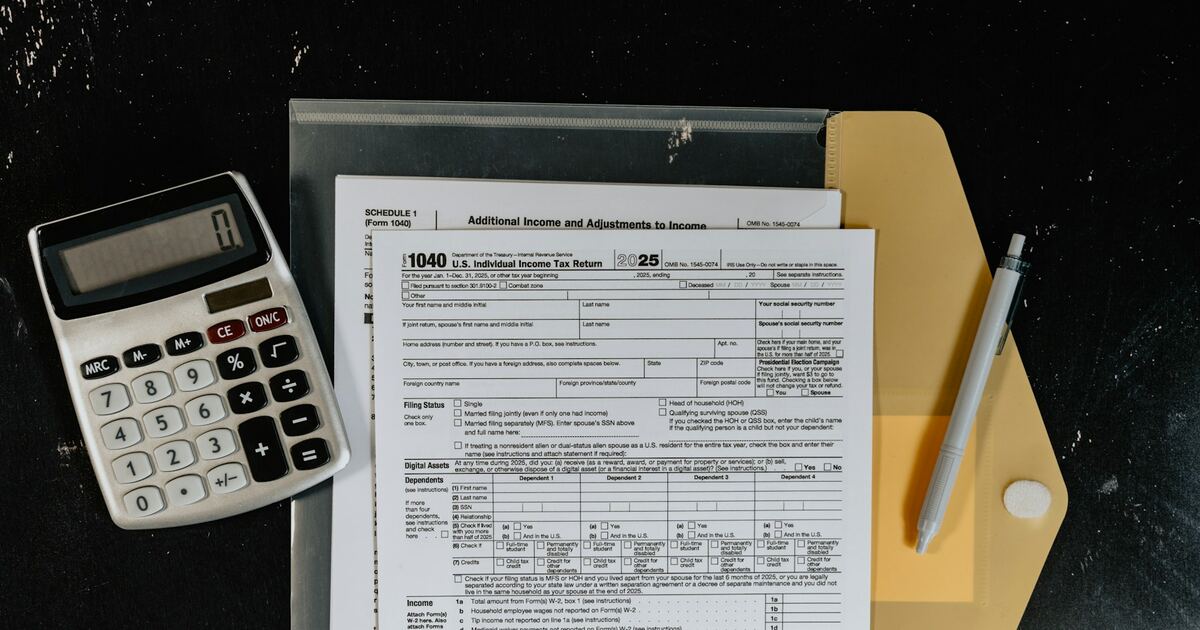 A trade agreement on a wooden table with a coffee mug and phone showing the Smart Barter app